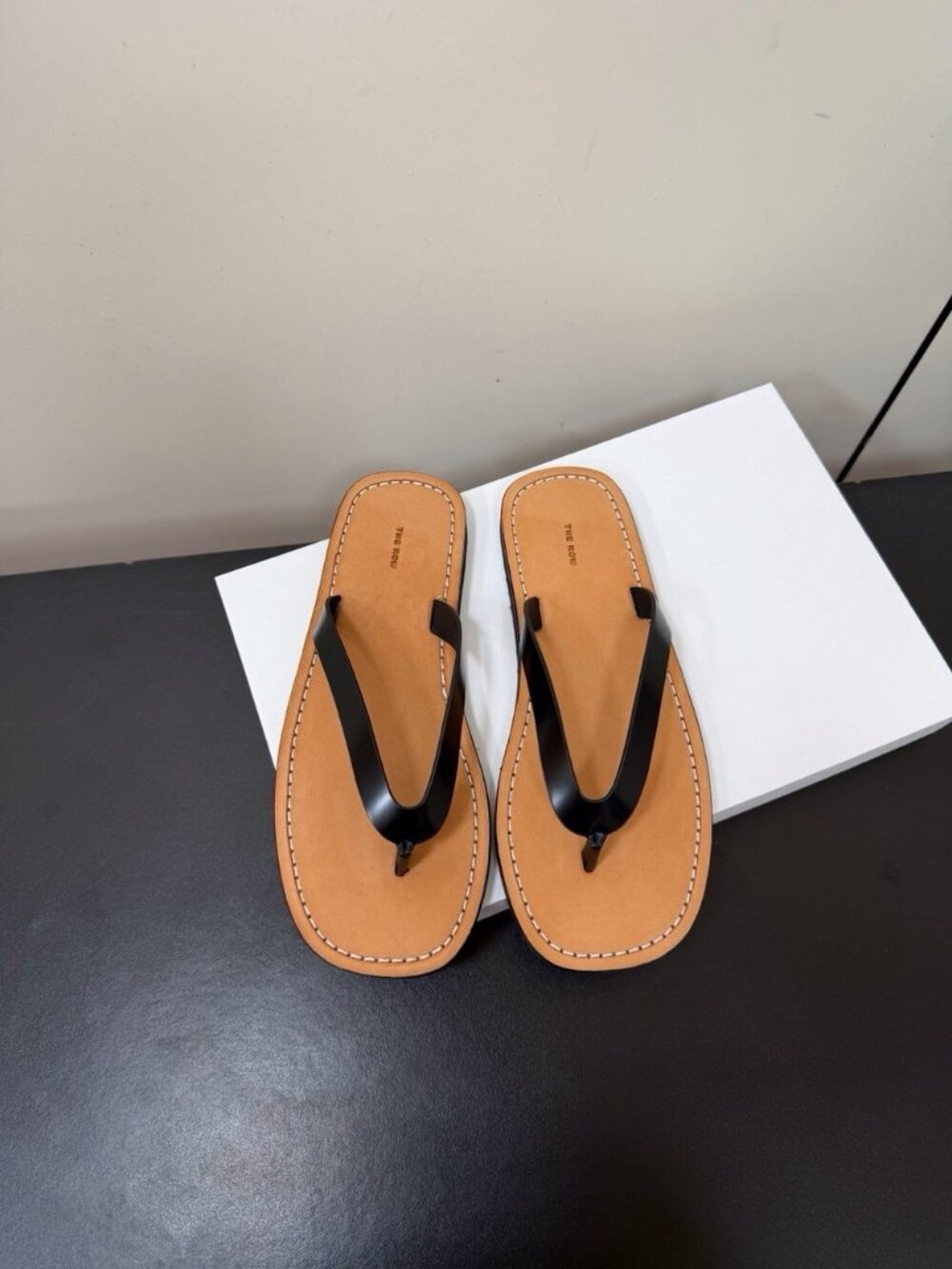 Women’s Tan Leather Flip-Flop Sandals with Black Straps